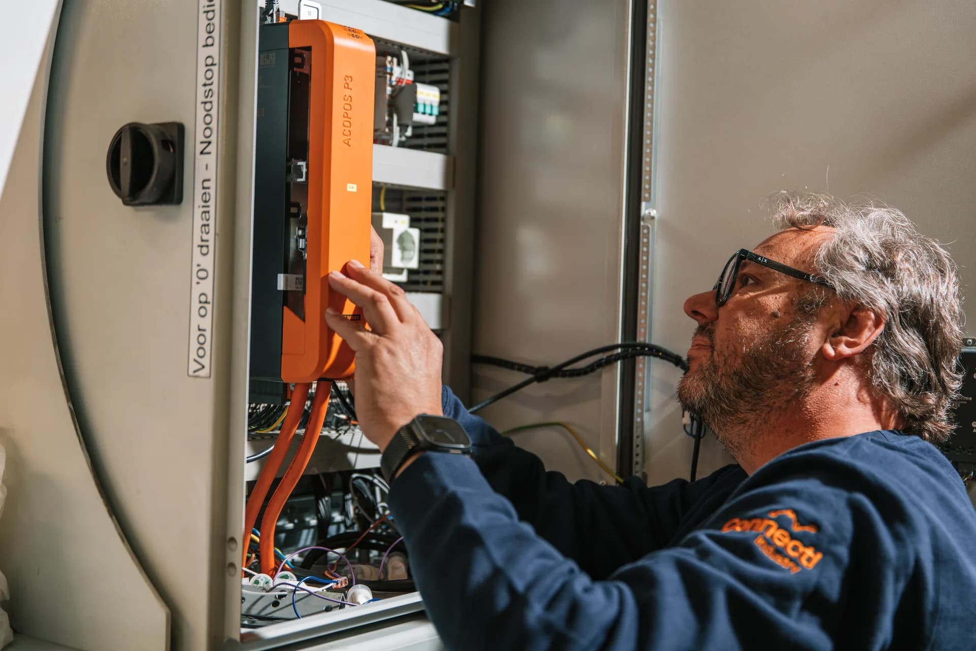 Engineer working on a control cabinet.