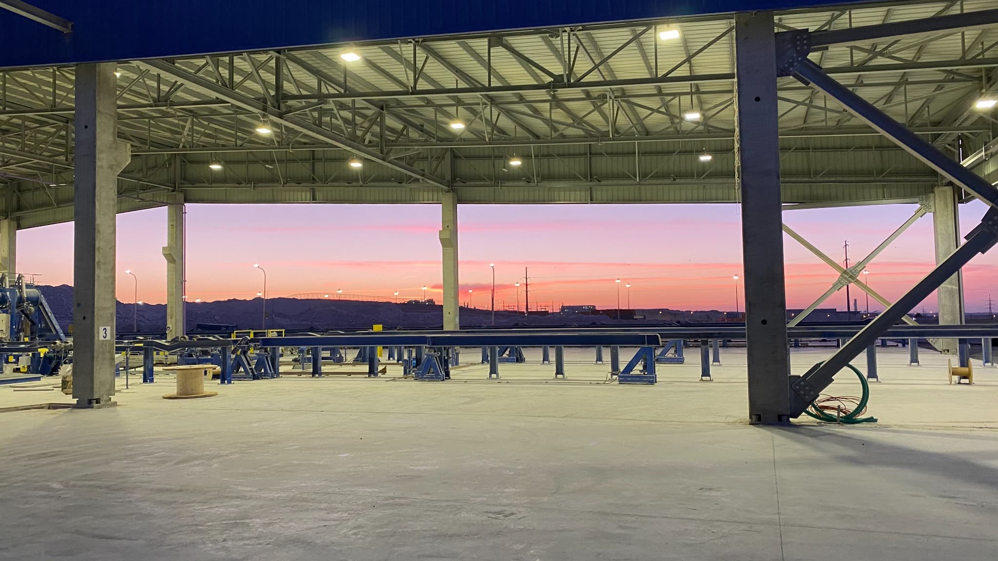 Installation hall at sunset during the build of a plant installation.